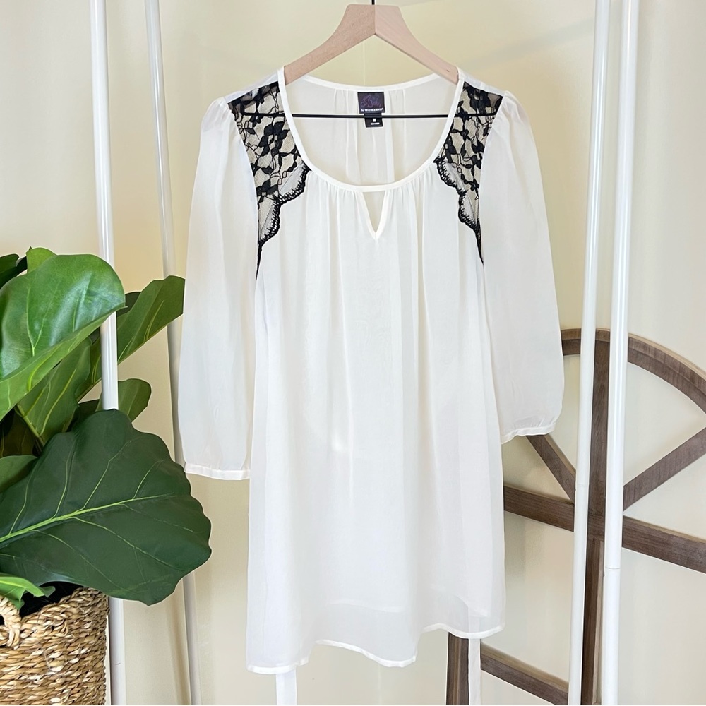 Oh Baby by Motherhood cream and black blouse with tie